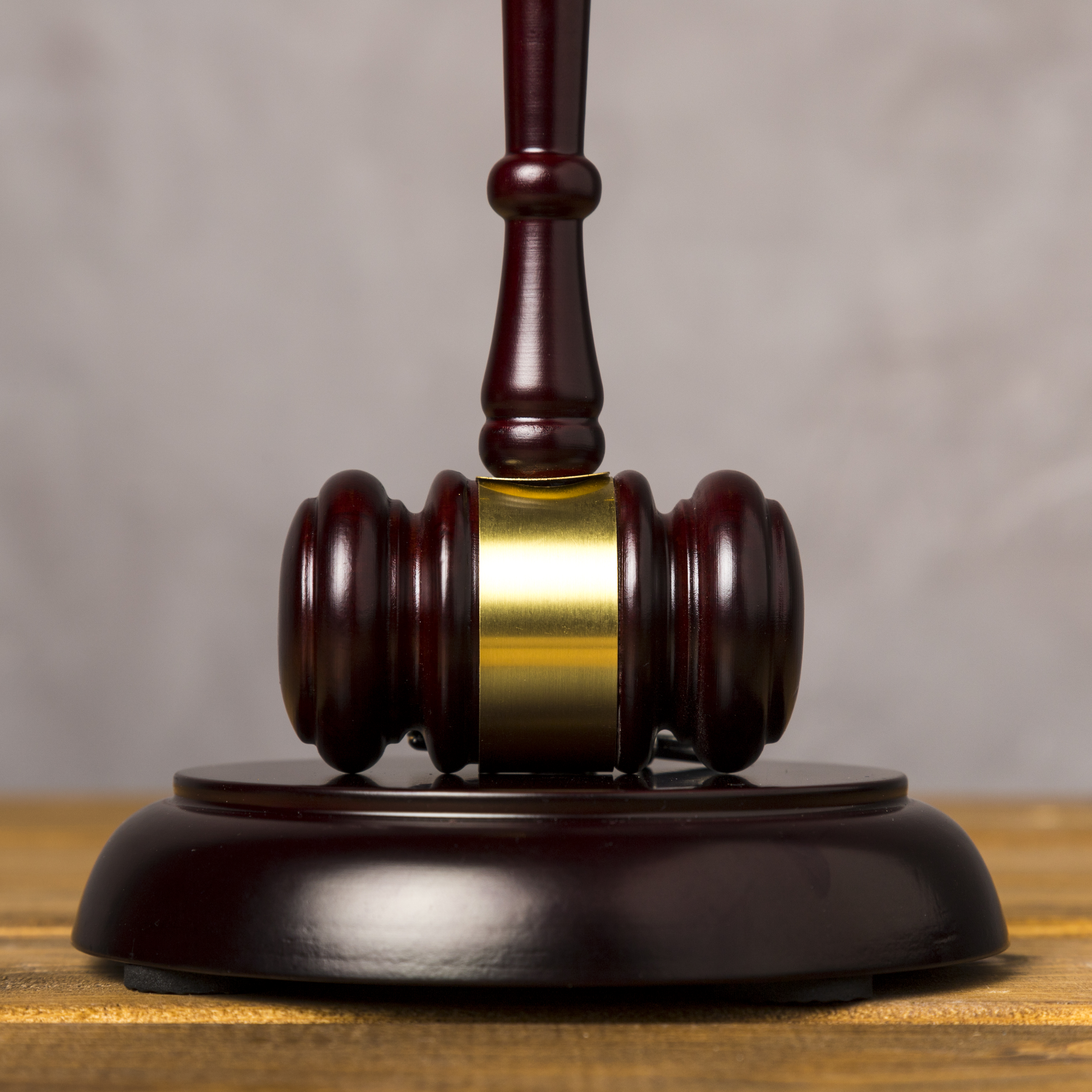 A wooden gavel on a desk